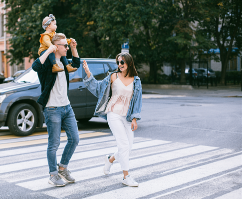 A Photo Of A Family Walking In Pedestrian Lane